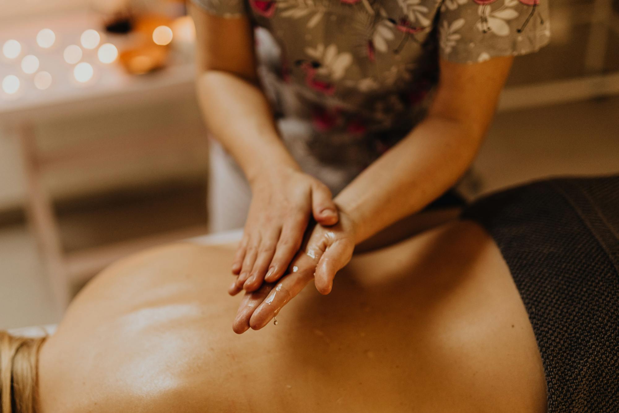 Therapist giving an oil massage